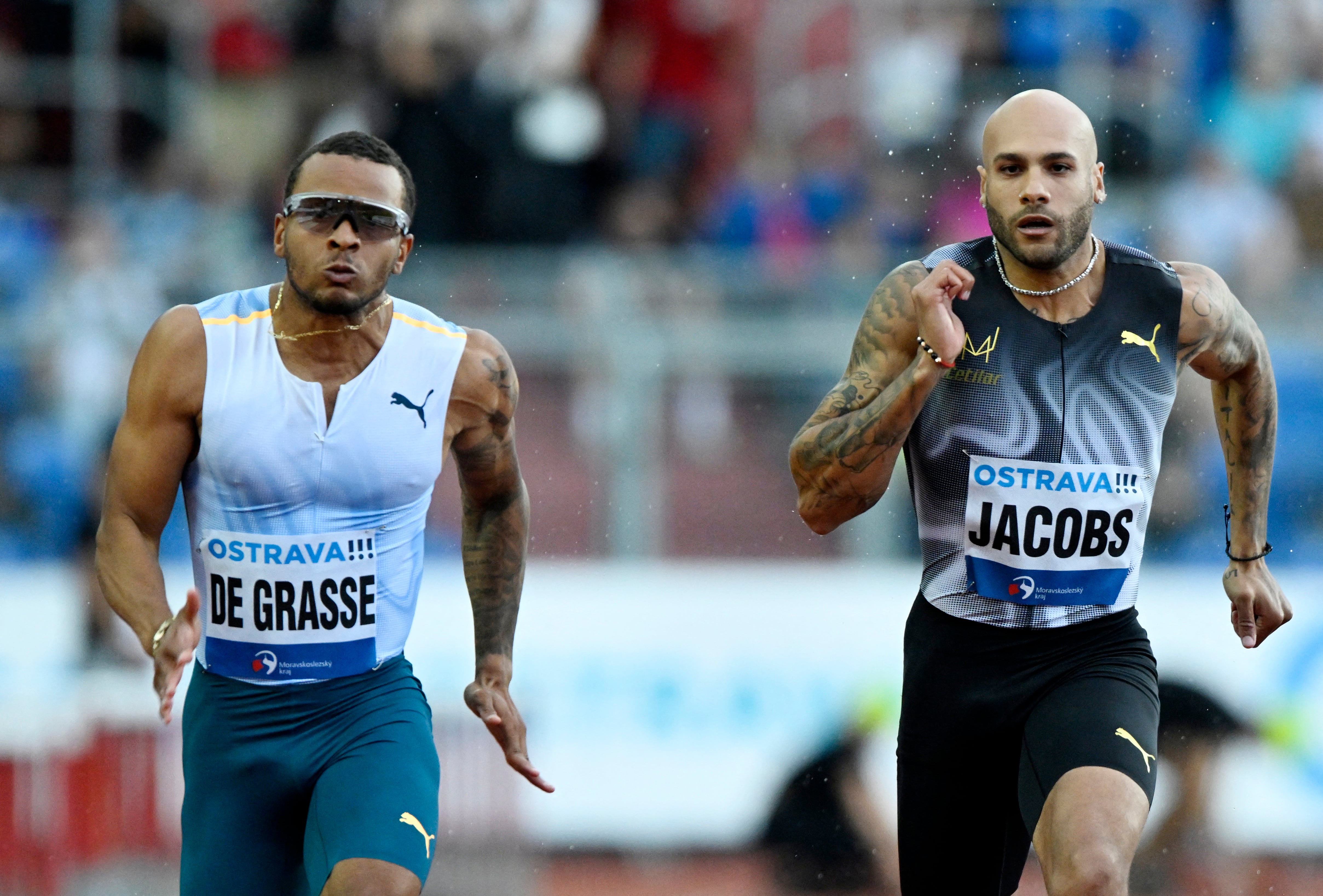  Andre De Grasse y Lamont Marcell Jacobs, dos pupilos de Reider (REUTERS/Radovan Stoklasa)