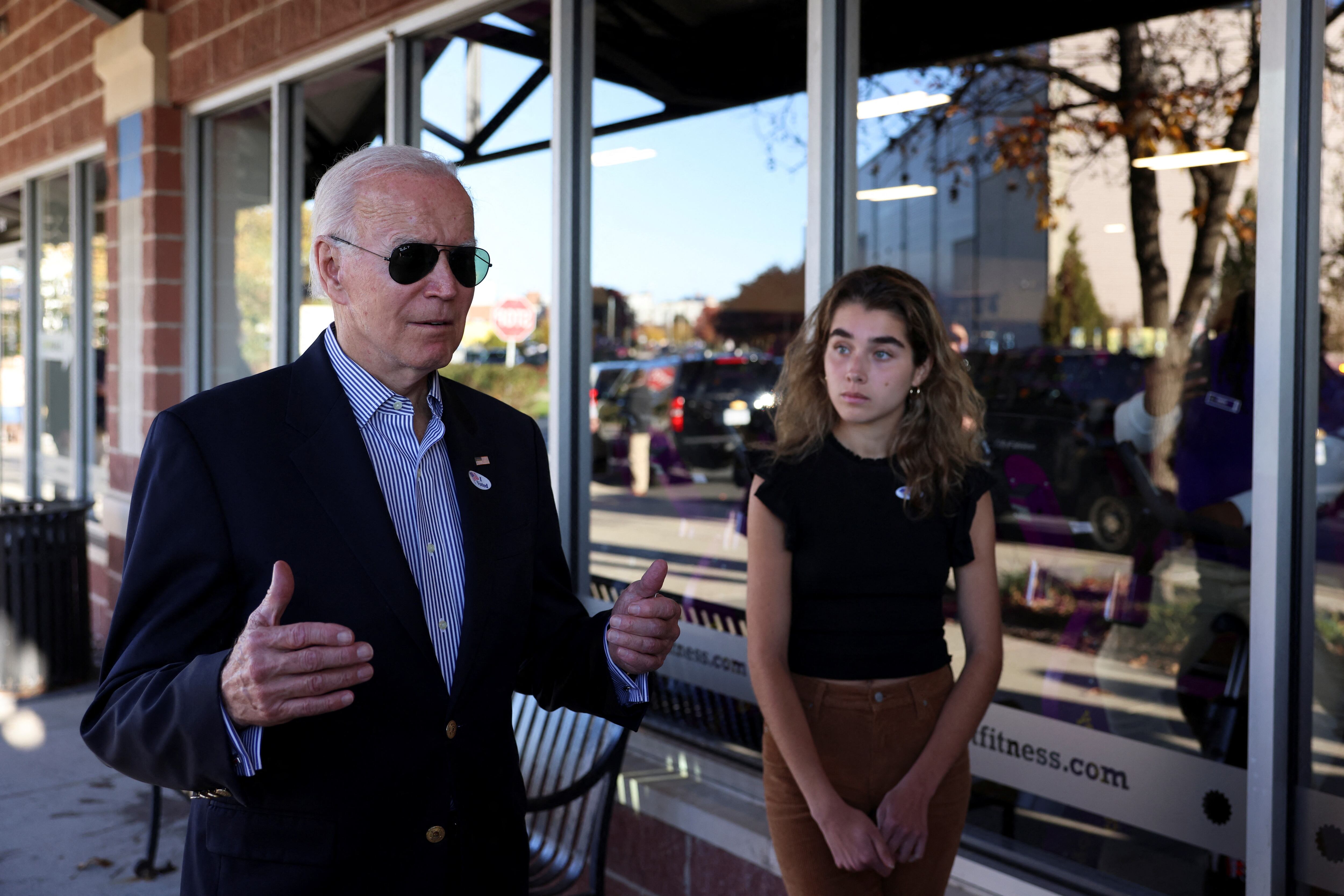 U.S. President Joe Biden speaks to media after casting his vote during early voting for the 2022 U.S. midterm elections with his granddaughter Natalie, a first-time voter, at a polling station in Wilmington, Delaware, U.S. October 29, 2022. REUTERS/Tasos Katopodis