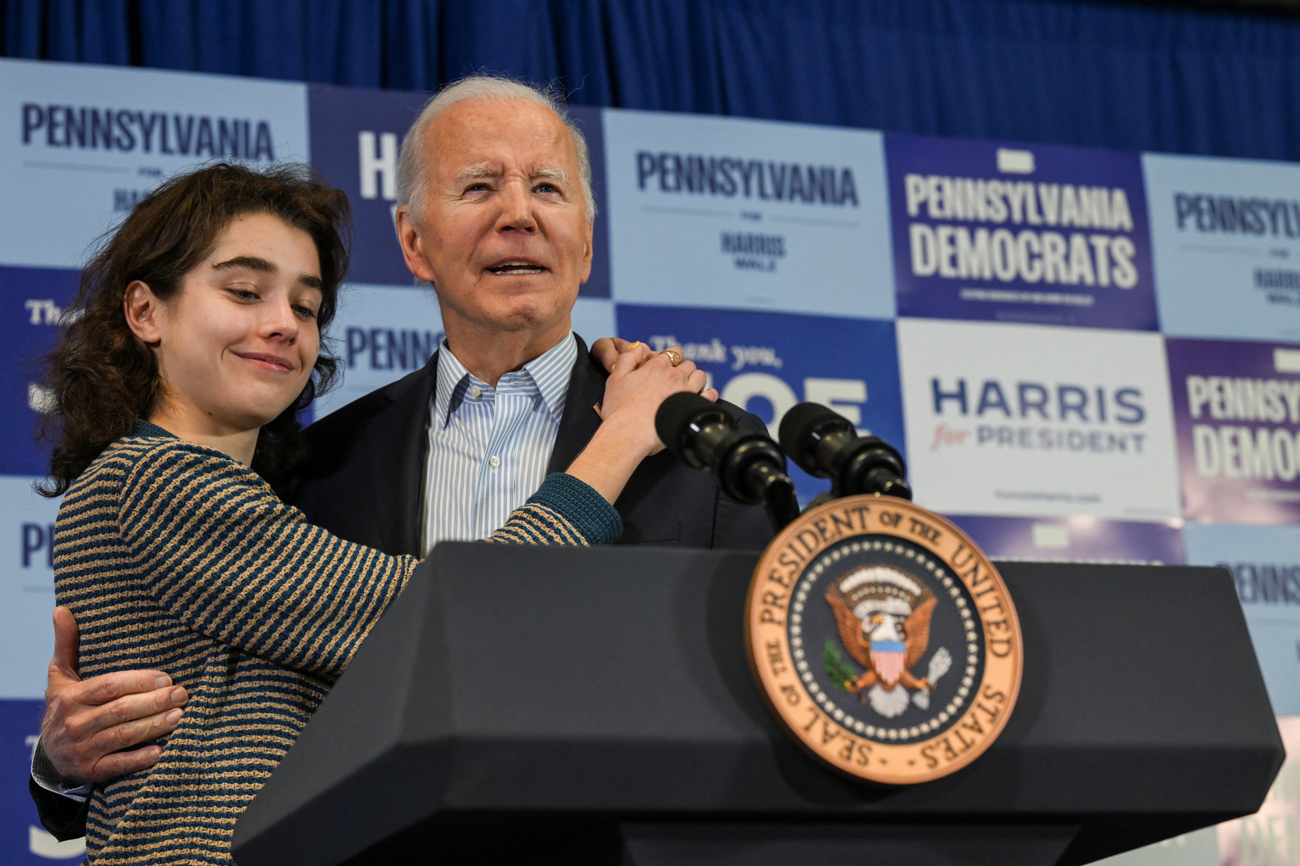 U.S. President Joe Biden hugs his granddaughter Natalie Biden during Carpenter’s Local 445 GOTV event in Scranton, Pennsylvania, U.S., November 2, 2024. REUTERS/Annabelle Gordon